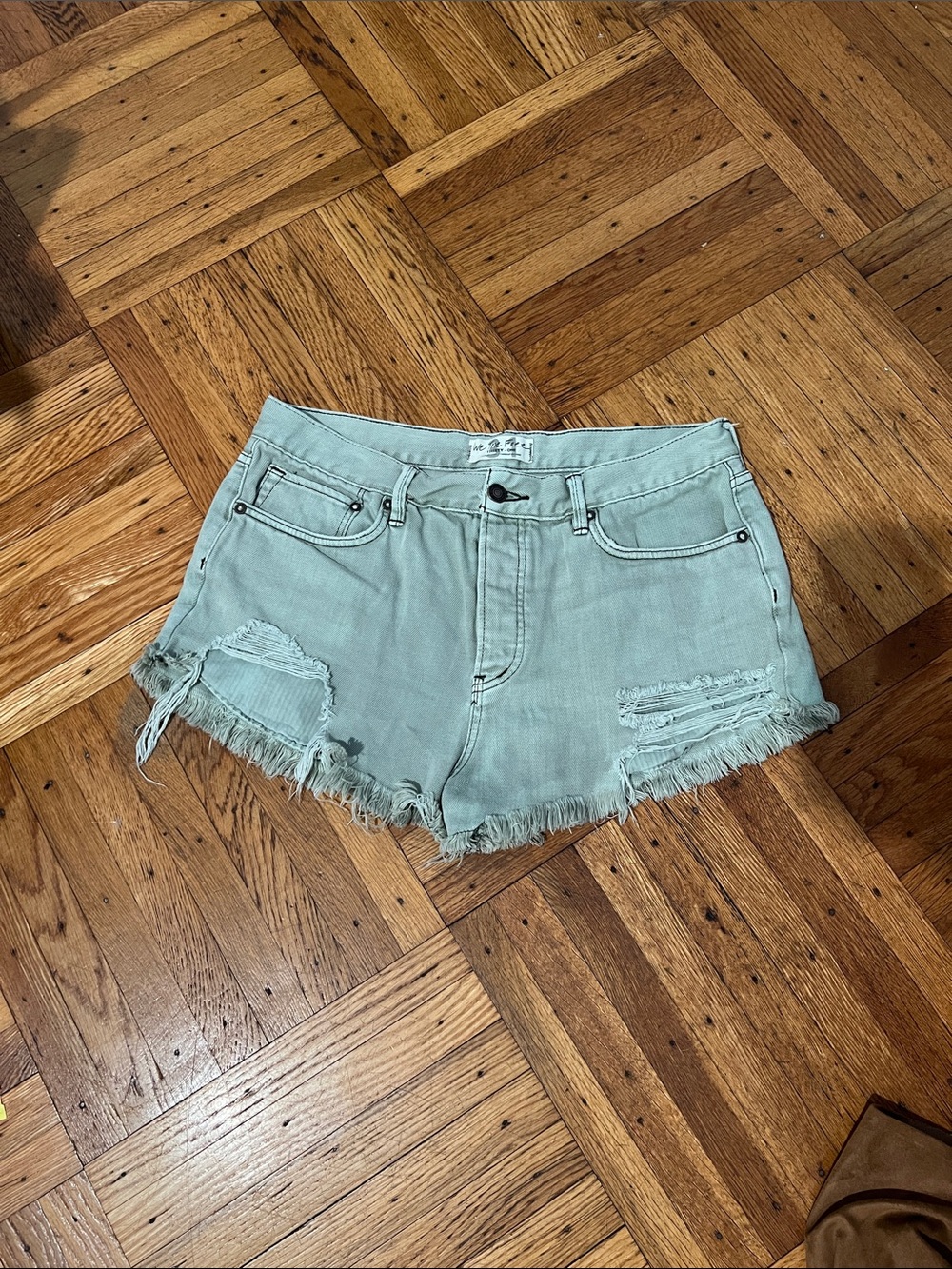 Free people Light Sage Distressed Fray Hem Denim Shorts size 31